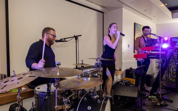 Singer and band performing 